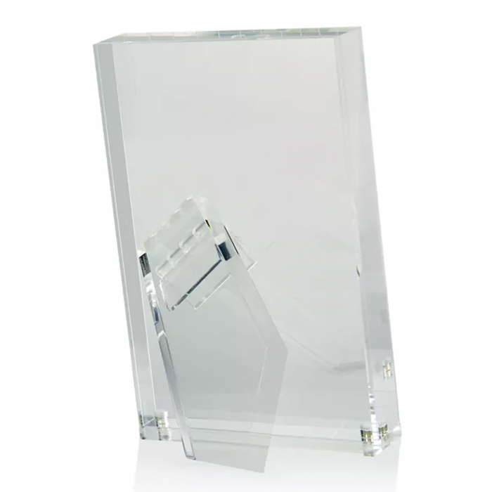 The Tizo Lucite Clear Frame is a minimalist, rectangular acrylic picture frame with a transparent support stand, allowing it to stand upright on flat surfaces. The empty frame is displayed against a white background.