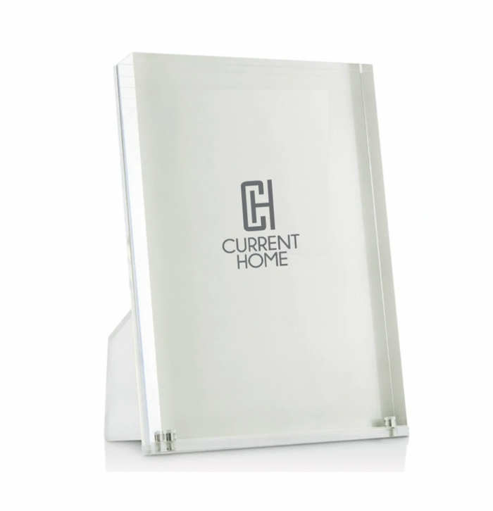 The Lucite Clear Frame by Tizo stands upright, featuring a minimalist design against a plain white background—an ideal modern display solution.