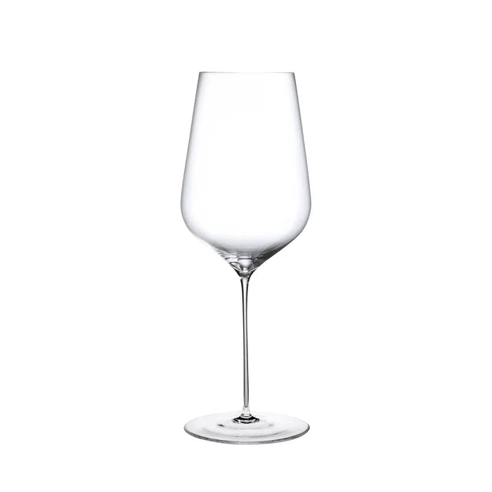 A clear, empty wine glass with a long stem and a wide bowl, crafted from lead-free crystal by Nude Glassware, stands upright against a white background. This elegant piece is part of the Stem Zero Barware collection, exemplifying the exceptional quality of Nude Glassware.